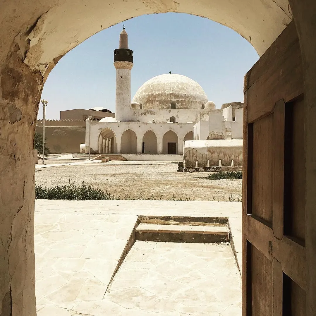 A visitor exploring historic Ibrahim Palace