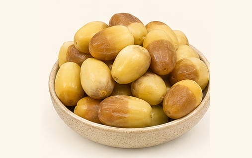 Golden Khalas rutab dates in a serving bowl